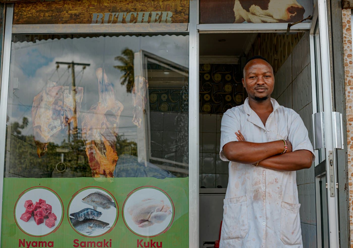 A shop owner at his door